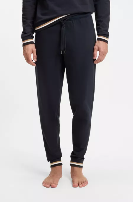 Cotton-terry tracksuit bottoms with signature stripes and logo