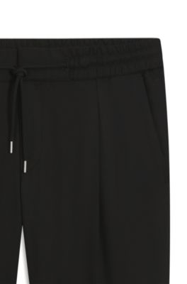 Pantalones slim fit de tejido de sarga con cintura con cord&oacute;n, Negro