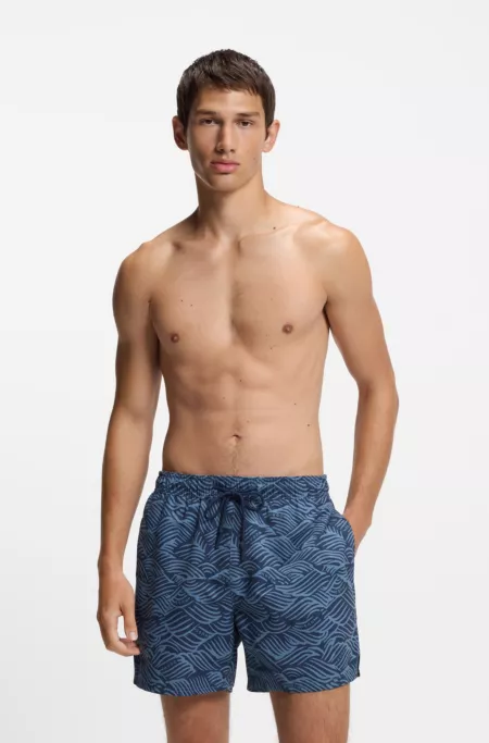 Swim shorts with logo artwork