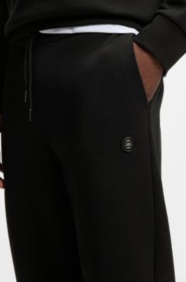 Pantalones de ch&aacute;ndal de algod&oacute;n con insignia con monograma Double&nbsp;B, Negro