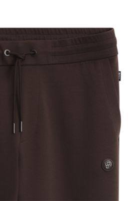 Pantalones de ch&aacute;ndal de algod&oacute;n con insignia con monograma Double&nbsp;B, Marr&oacute;n oscuro