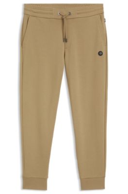 Pantalones de ch&aacute;ndal de algod&oacute;n con insignia con monograma Double&nbsp;B, Caqui