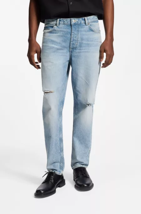 Blue tapered-fit jeans in distressed denim