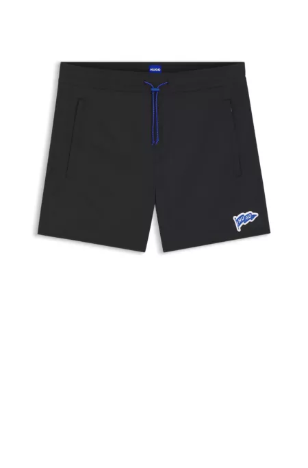 Water-repellent shorts with flag logo