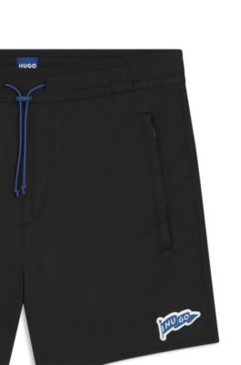 Water-repellent shorts with flag logo, Black
