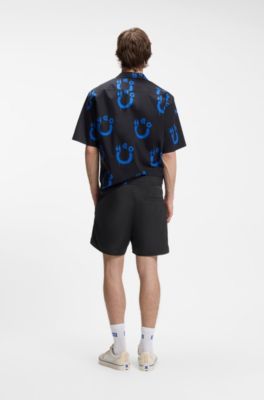Short d&eacute;perlant avec logo drapeau, Noir