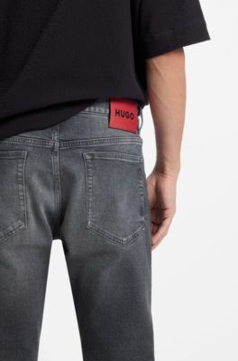 Jeans slim fit en c&oacute;modo denim el&aacute;stico gris, Gris