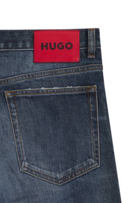Jeans slim fit en denim el&aacute;stico azul oscuro desgastado, Azul