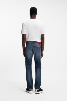 Jeans slim fit en denim el&aacute;stico azul oscuro desgastado, Azul
