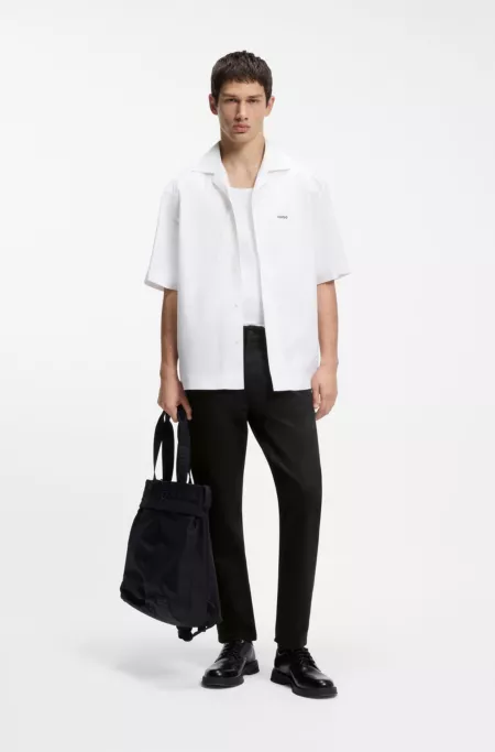 Black tapered-fit jeans in thermo-regulating denim