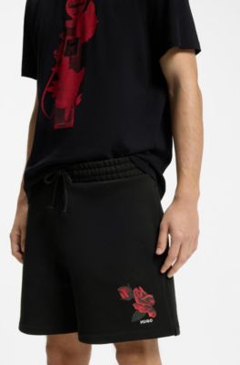 Shorts de felpa de algod&oacute;n con ilustraci&oacute;n de rosas, Negro
