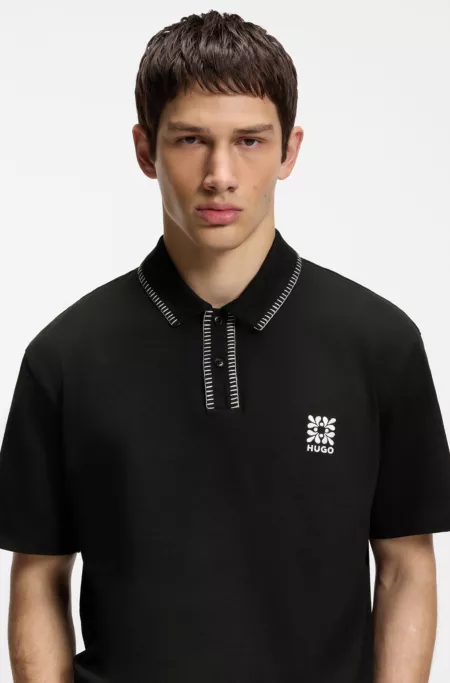 Logo-artwork polo shirt with blanket stitching
