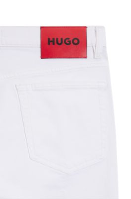 Jeans slim fit de denim el&aacute;stico blanco, Blanco