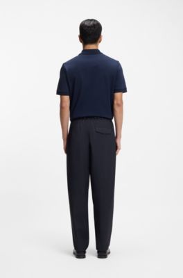 Pantalones tapered fit de tejido el&aacute;stico t&eacute;cnico lavable, Azul oscuro