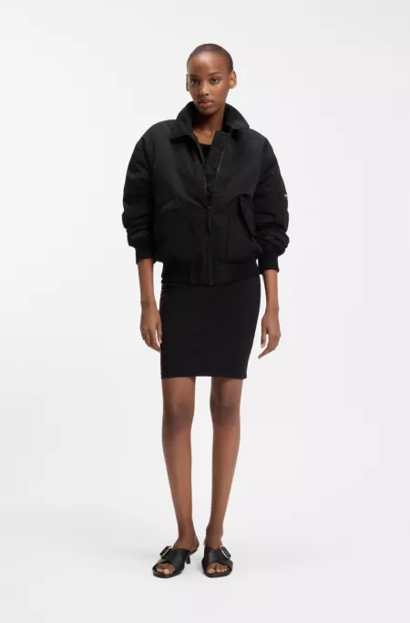 Water-repellent jacket with zipped sleeve pocket