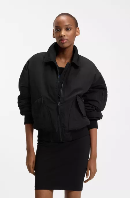 Water-repellent jacket with zipped sleeve pocket