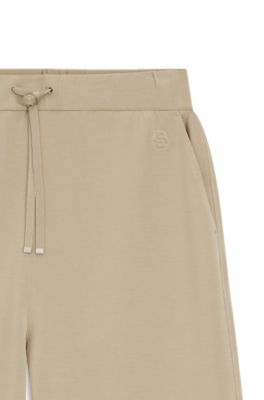 Pantalones de ch&aacute;ndal relaxed fit con monograma Double&nbsp;B, Beige claro
