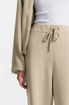 Pantalones de ch&aacute;ndal relaxed fit con monograma Double&nbsp;B, Beige claro