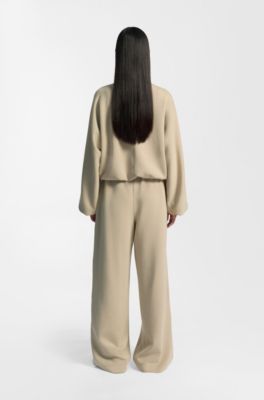 Pantalones de ch&aacute;ndal relaxed fit con monograma Double&nbsp;B, Beige claro