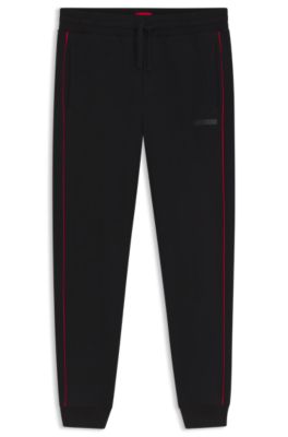 Contrast-piping tracksuit bottoms in stretch cotton, Black