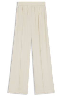 Pantalones relaxed fit en crep&eacute; fluido, Blanco