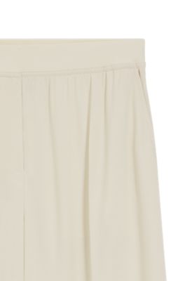 Pantalones relaxed fit en crep&eacute; fluido, Blanco