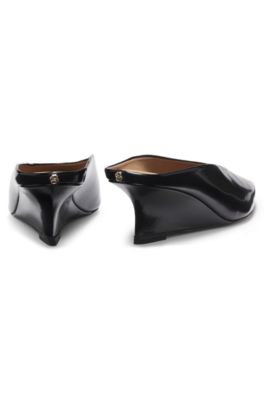 Wedge-heel mules in leather, Black