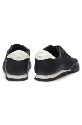 Embossed-logo trainers in leather, Black