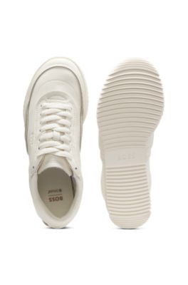 Embossed-logo trainers in leather, White