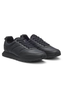 Low-top trainers with monogrammed uppers, Black