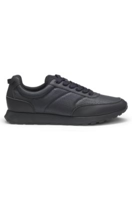Low-top trainers with monogrammed uppers, Black