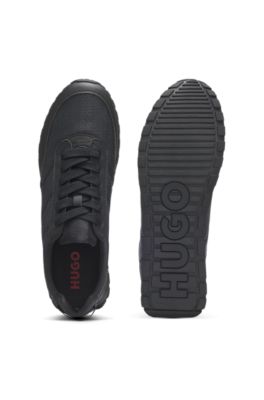 Low-top trainers with monogrammed uppers, Black