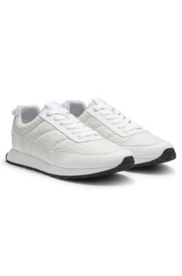 Low-top trainers with monogrammed uppers, White