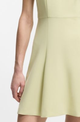 Sleeveless dress with gold-tone flower brooch, Beige