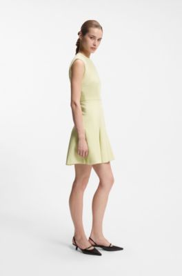 Sleeveless dress with gold-tone flower brooch, Beige