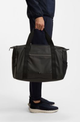 Reflective-detail holdall in faux leather, Black
