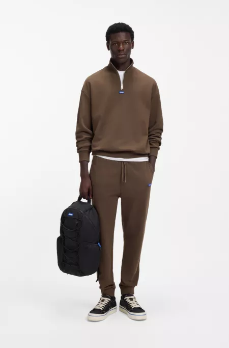 Backpack with blue rubber logo patch