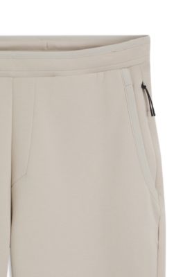 Pantalones de ch&aacute;ndal de algod&oacute;n con gr&aacute;fico reflectante, Beige claro