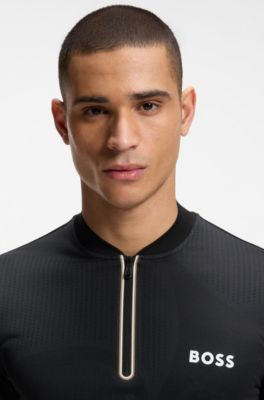 Polo slim fit en punto con detalles anat&oacute;micos y cuello con cremallera, Negro