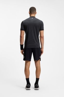 Polo slim fit en punto con detalles anat&oacute;micos y cuello con cremallera, Negro