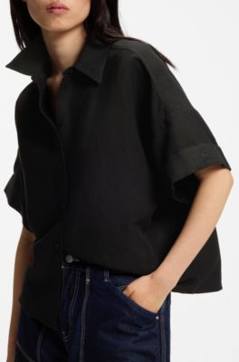 Blusa regular fit con pu&ntilde;os enrollados, Negro