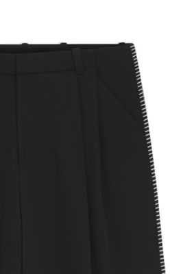 Pantalones de pinzas con detalles en punto de fest&oacute;n, Negro