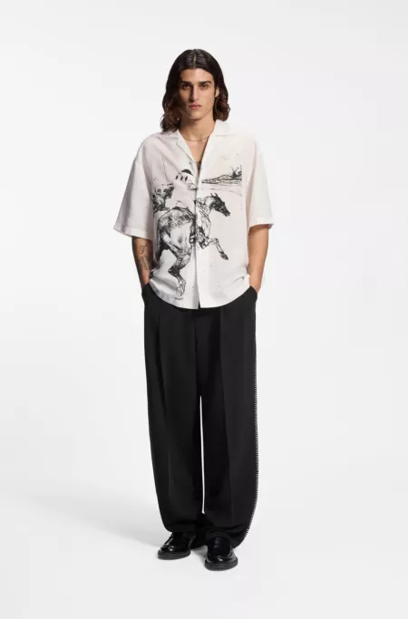 Pleat-front pants with whipstitch details