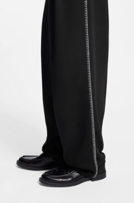 Pleat-front pants with whipstitch details, Black