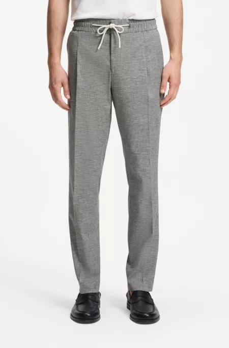 Slim-fit trousers in performance sharkskin