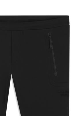 Porsche x BOSS track pants with tonal reflective branding, Black