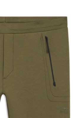 Porsche x BOSS track pants with tonal reflective branding, Light Green