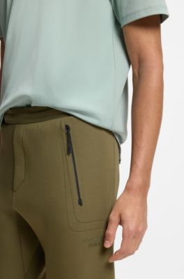 Porsche x BOSS track pants with tonal reflective branding, Light Green