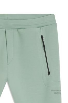 Porsche x BOSS track pants with tonal reflective branding, Light Green