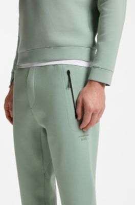 Porsche x BOSS track pants with tonal reflective branding, Light Green
